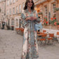 Elegantes geknöpftes Blumenkleid mit hohem V-Ausschnitt und Taille