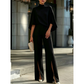 Set voor dames bestaande uit een elegante cape-top met hoge kraag en een broek met wijde pijpen