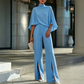 Set voor dames bestaande uit een elegante cape-top met hoge kraag en een broek met wijde pijpen